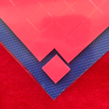 A thermally conductive gap pad from Polymer Science is die-cut into many smaller parts.